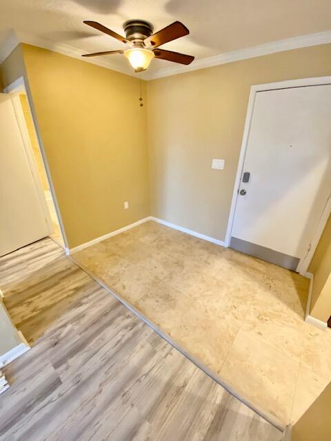 605 Colonial Drive, Unit 5 Fort Walton Beach, FL 32547 - Photo 4 of 31 a view of a room with garage and wooden floor