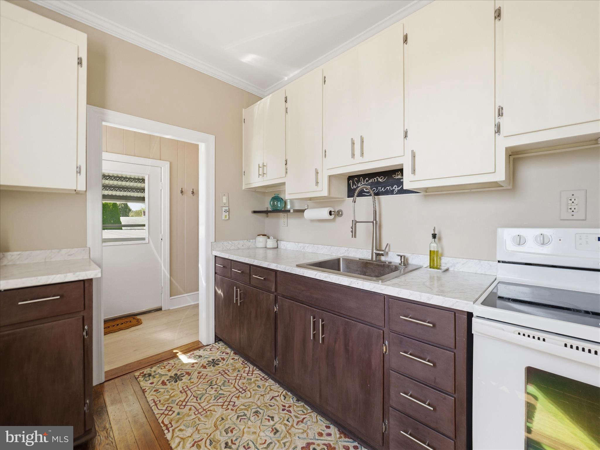 14 South High Street Funkstown, MD 21734 - Photo 12 of 33 a kitchen with a sink window and cabinets
