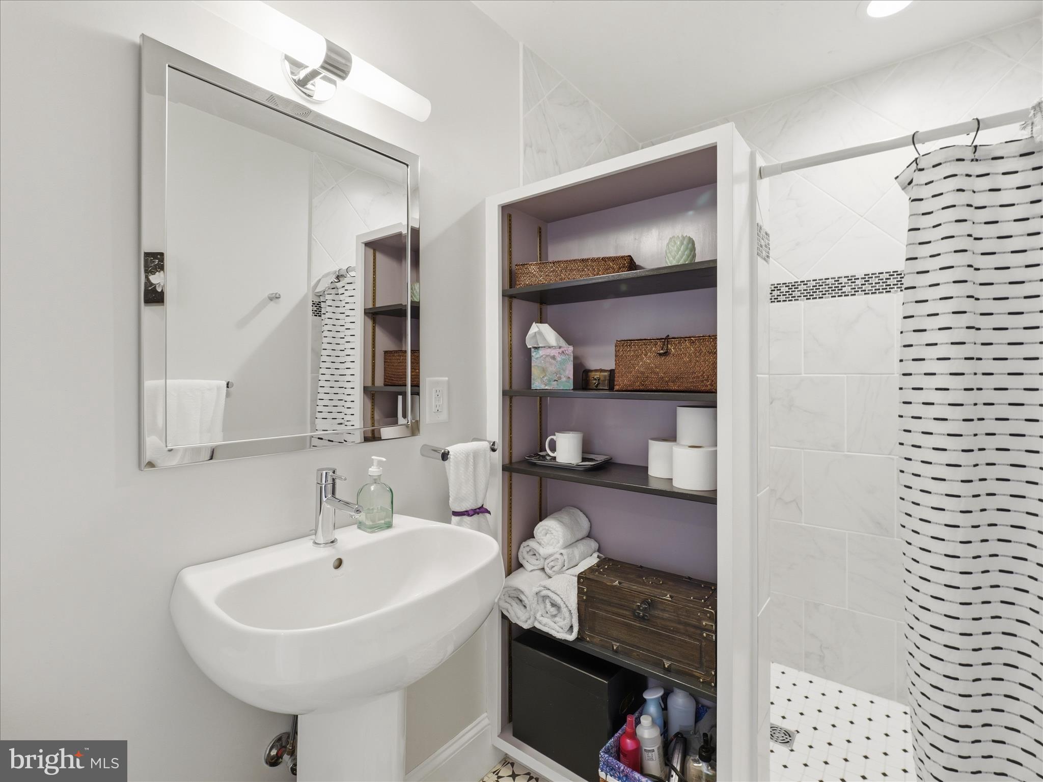 14 South High Street Funkstown, MD 21734 - Photo 18 of 33 a bathroom with a sink and a mirror