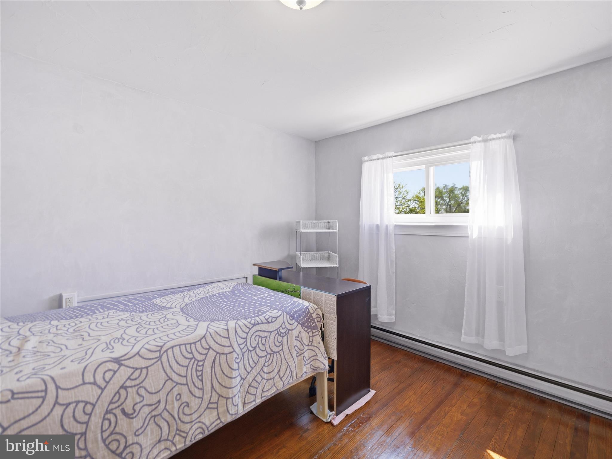 14 South High Street Funkstown, MD 21734 - Photo 23 of 33 a bedroom with a bed window and wooden floor