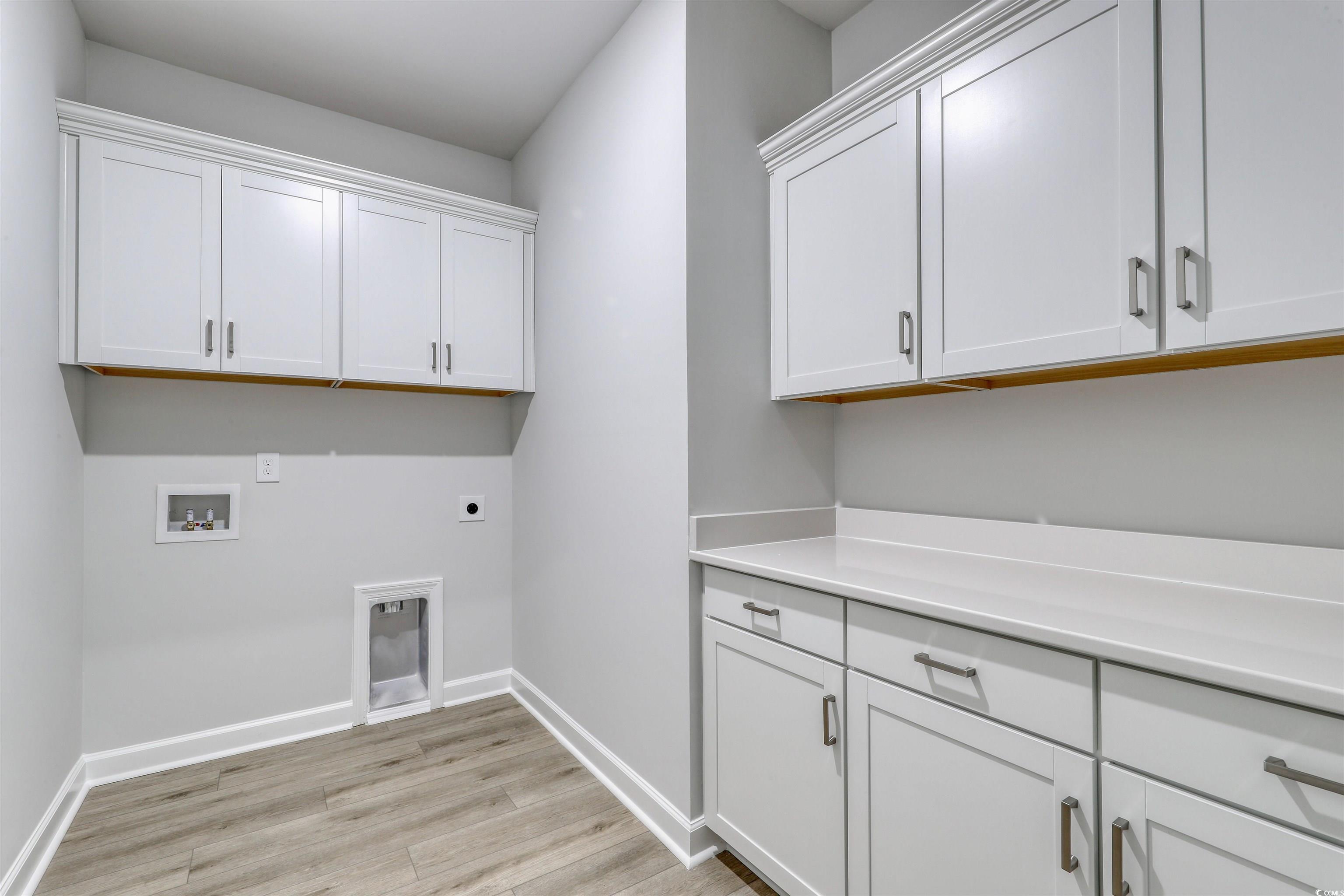 1083 Laconic Drive Myrtle Beach, SC 29588 - Photo 17 of 40 Washroom featuring light wood-style floors, cabinet space, electric dryer hookup, and washer hookup
