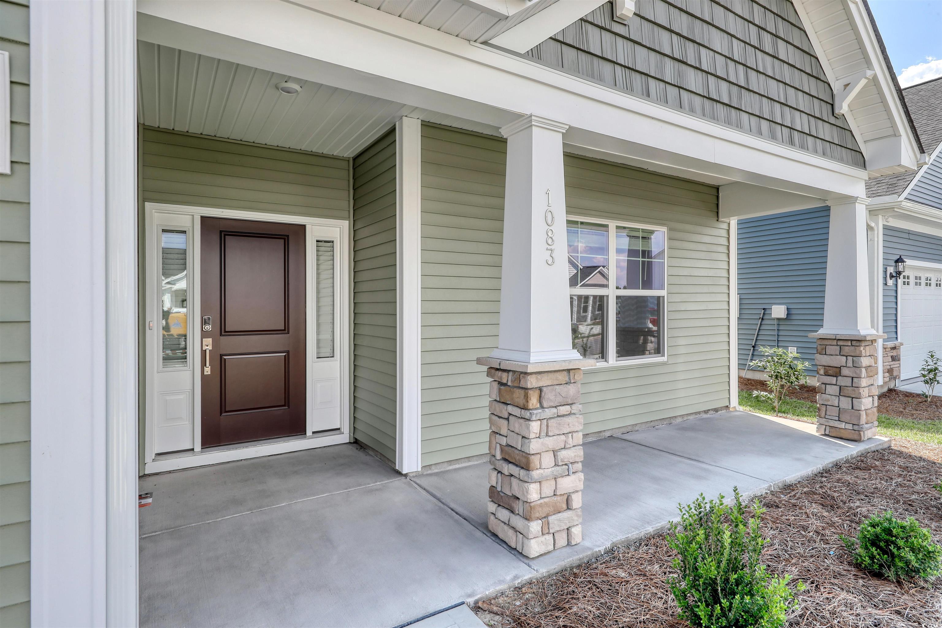 1083 Laconic Drive Myrtle Beach, SC 29588 - Photo 2 of 40 Doorway to property featuring covered porch