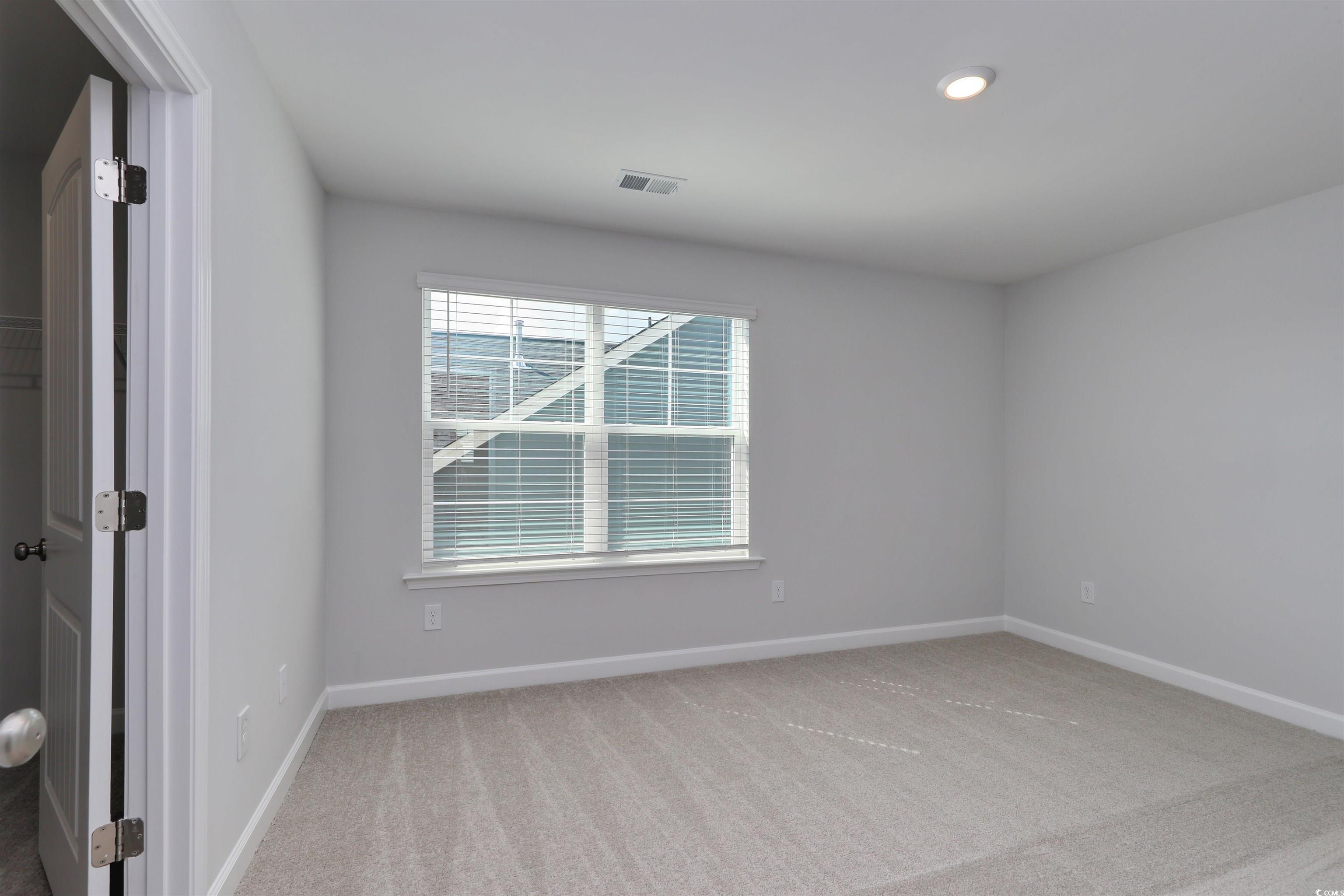1083 Laconic Drive Myrtle Beach, SC 29588 - Photo 26 of 40 Unfurnished room featuring light carpet and recessed lighting