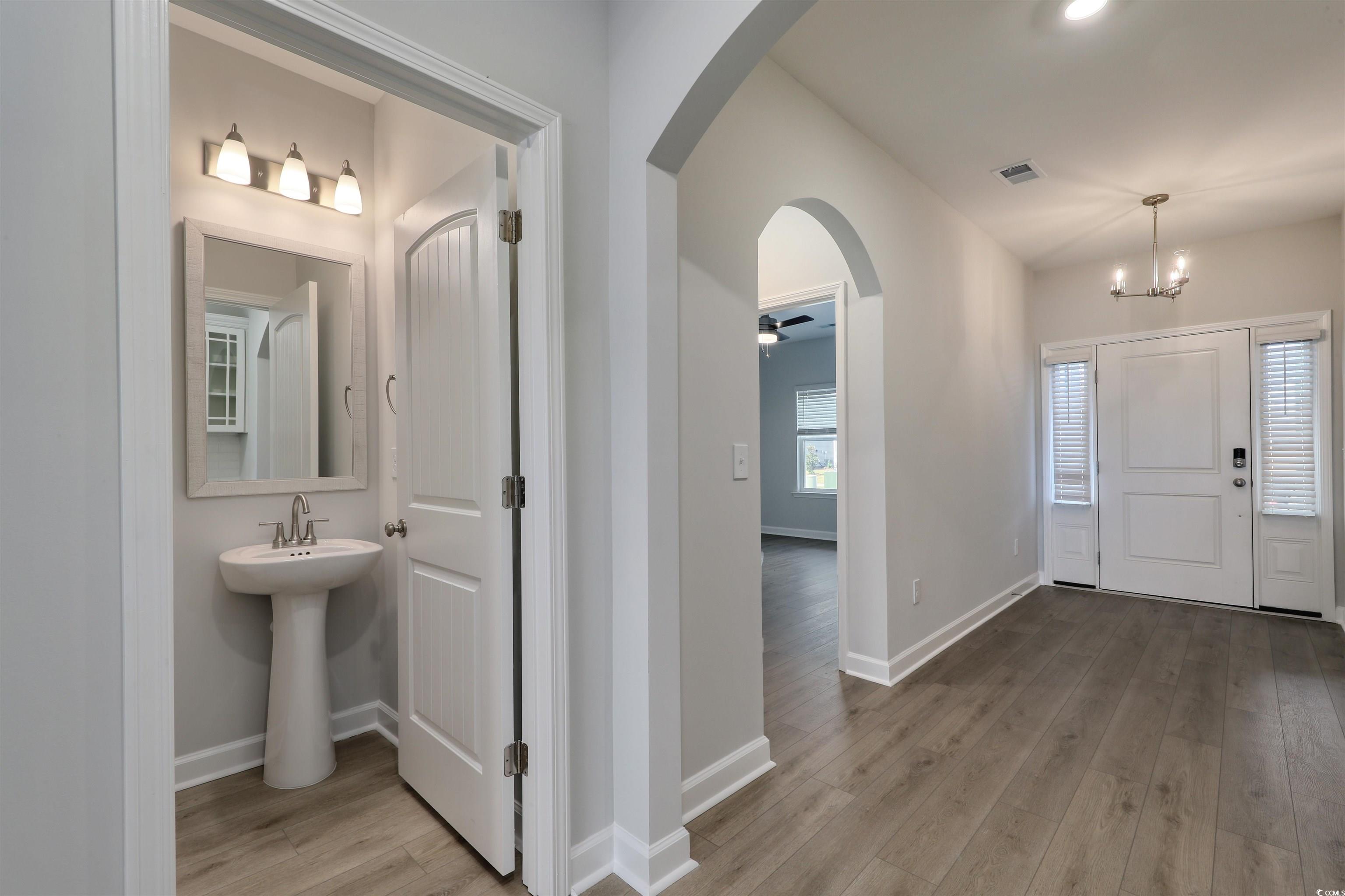 1083 Laconic Drive Myrtle Beach, SC 29588 - Photo 5 of 40 Entryway featuring arched walkways, light wood-type flooring, ceiling fan, and recessed lighting
