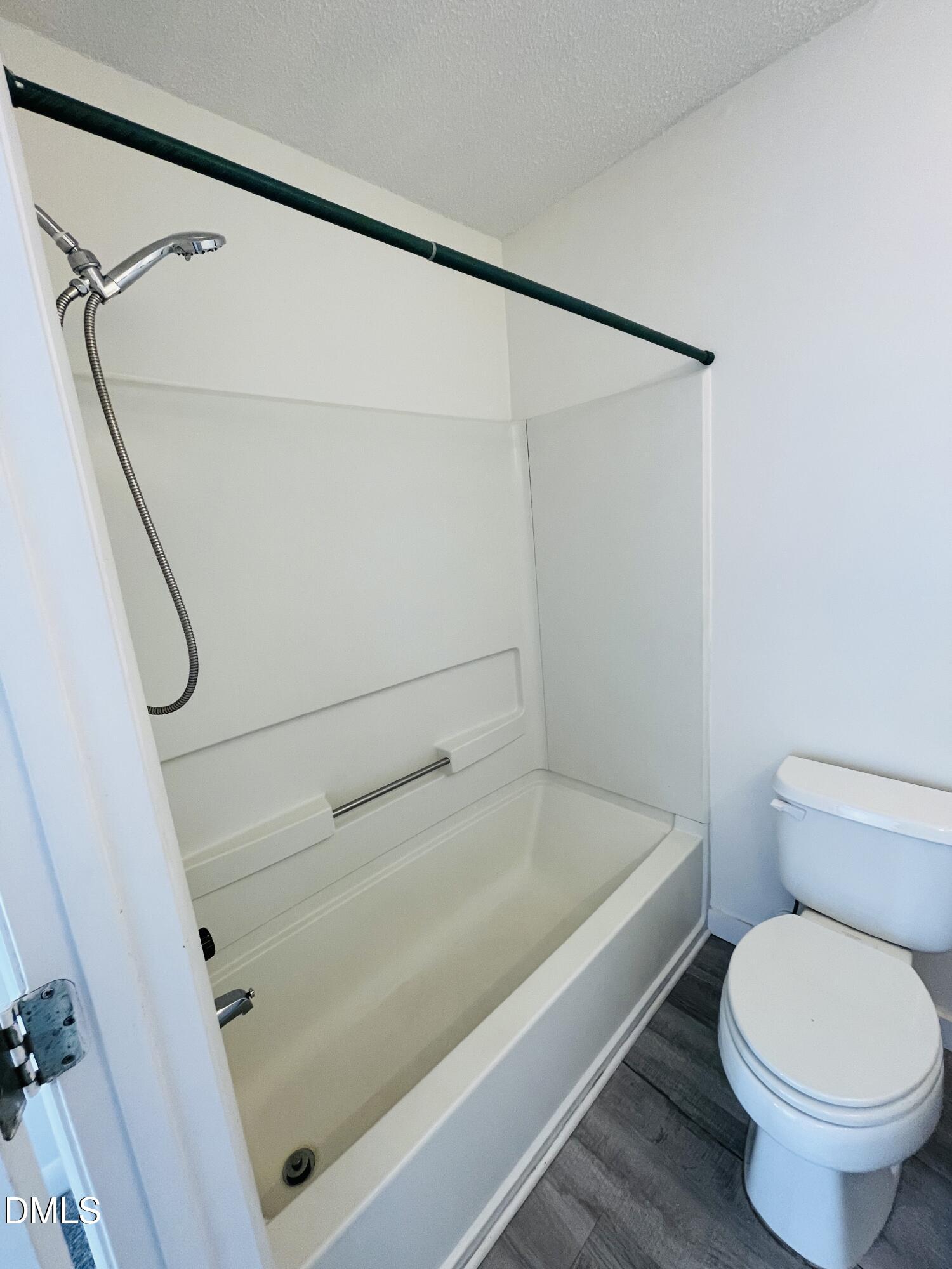 1230 University Court, Unit 204 Raleigh, NC 27606 - Photo 7 of 17 a bathroom with a toilet and a shower
