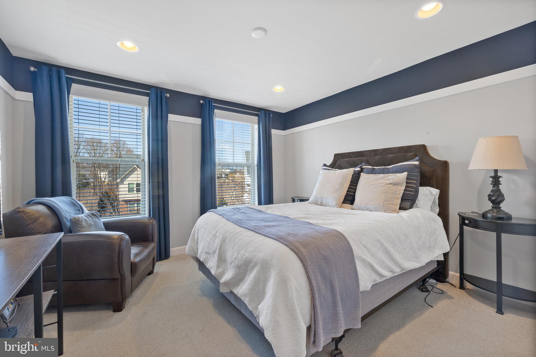 13410 Redspire Drive Silver Spring, MD 20906 - Photo 22 of 43 a bedroom with a bed and wooden floor