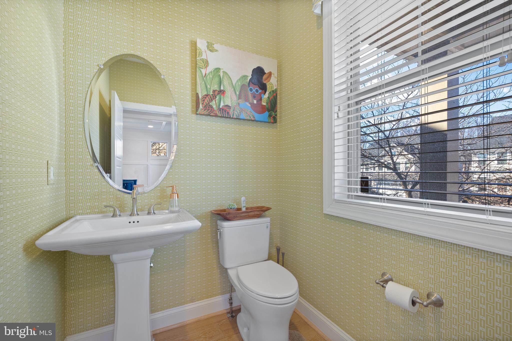 13410 Redspire Drive Silver Spring, MD 20906 - Photo 28 of 43 a bathroom with a toilet sink and mirror
