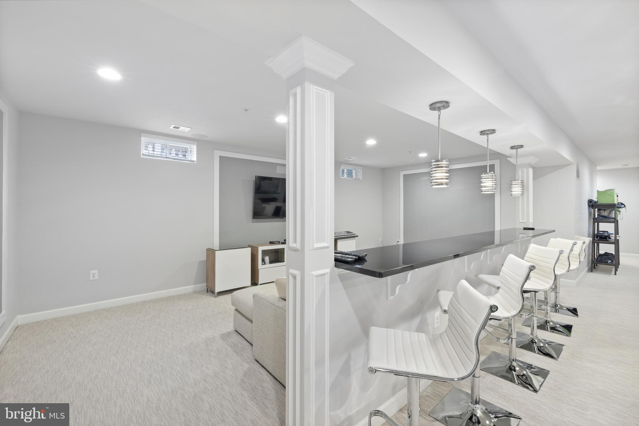 13410 Redspire Drive Silver Spring, MD 20906 - Photo 33 of 43 a living room with furniture and a flat screen tv