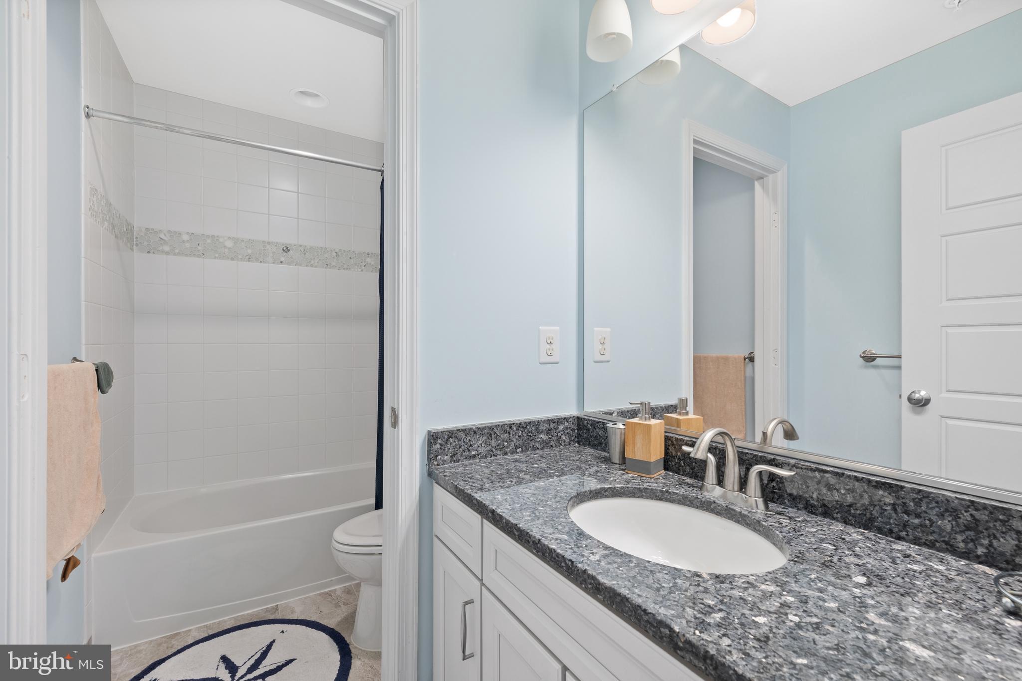 13410 Redspire Drive Silver Spring, MD 20906 - Photo 35 of 43 a bathroom with a granite countertop sink toilet and shower