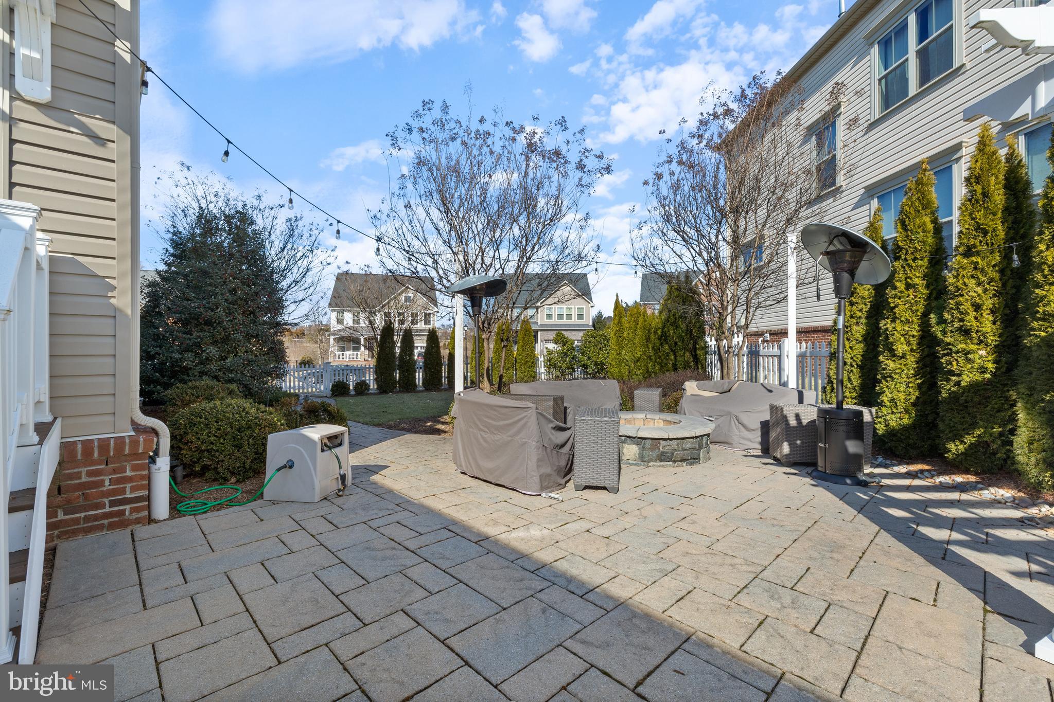 13410 Redspire Drive Silver Spring, MD 20906 - Photo 38 of 43 a view of a patio with table and chairs and potted plants