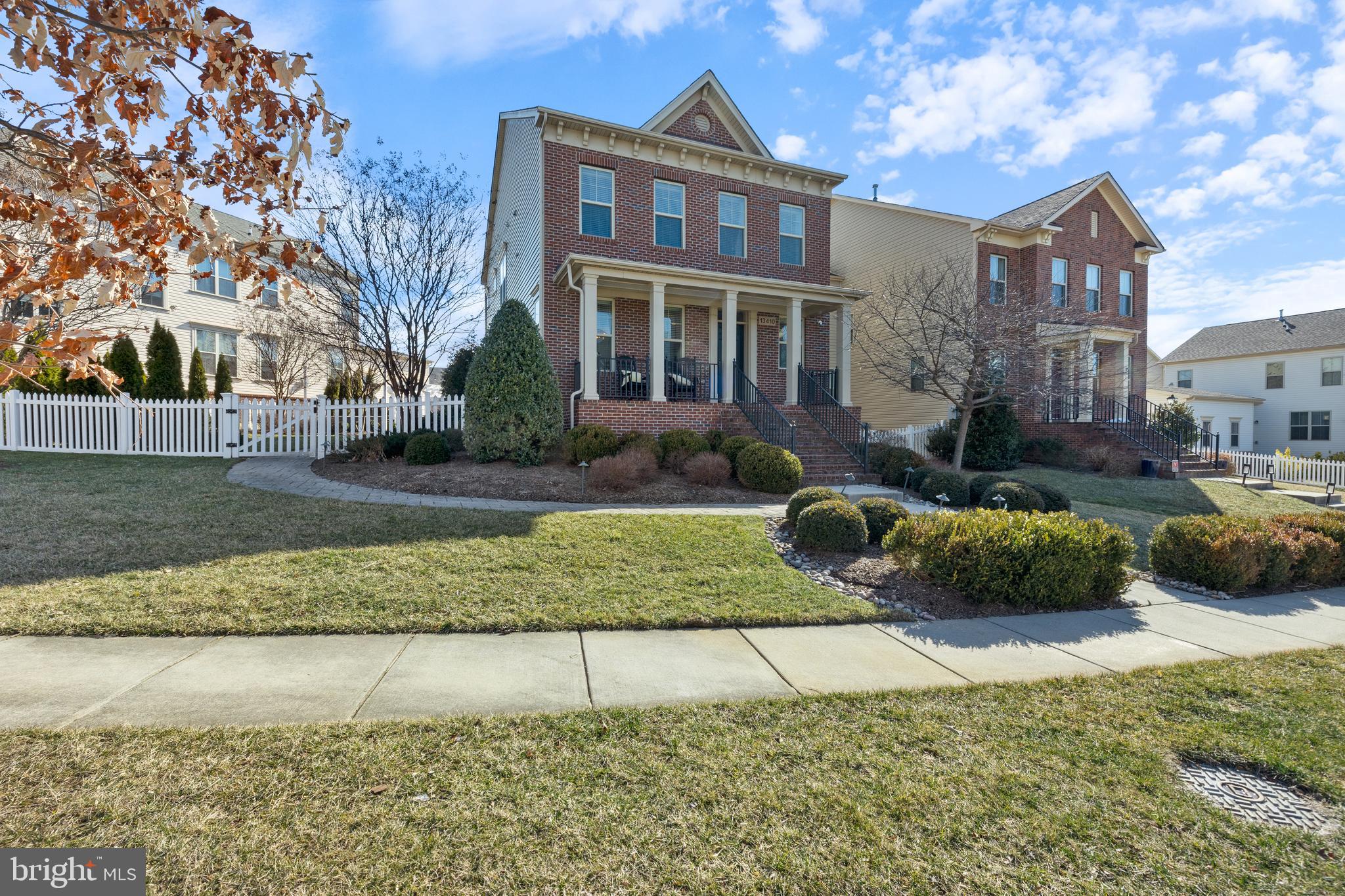 13410 Redspire Drive Silver Spring, MD 20906 - Photo 43 of 43 a front view of a house with a yard and outdoor seating