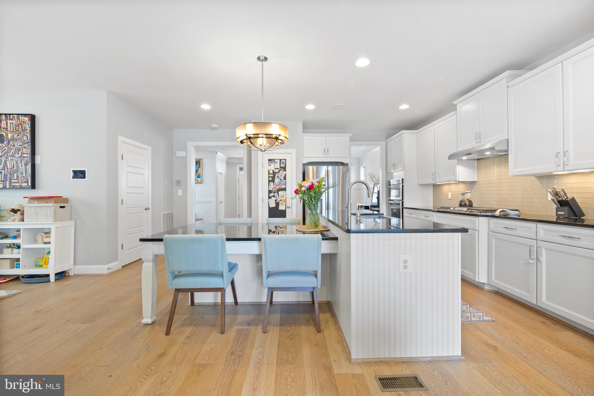 13410 Redspire Drive Silver Spring, MD 20906 - Photo 8 of 43 a kitchen with a table and chairs in it