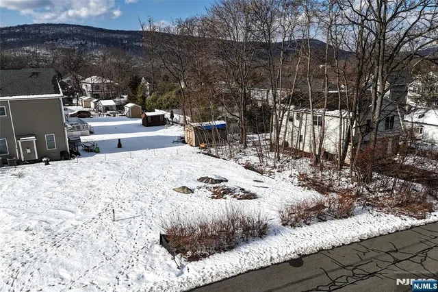 a view of a terrace with chairs and a fire pit