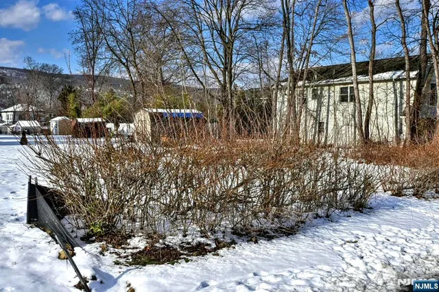 a view of a patio with furniture and a yard