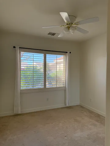 a bathroom with a sink vanity and mirror