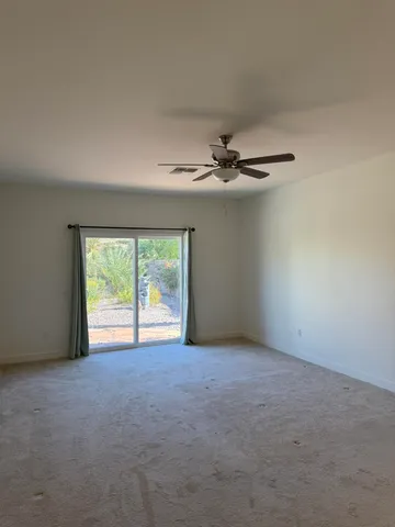 a view of an empty room with a glass door