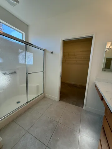 a view of a backyard with potted plants