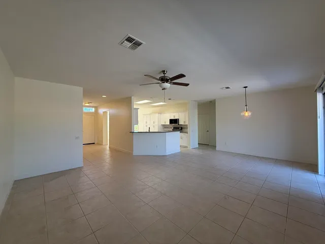 a view of a kitchen with a sink and cabinet