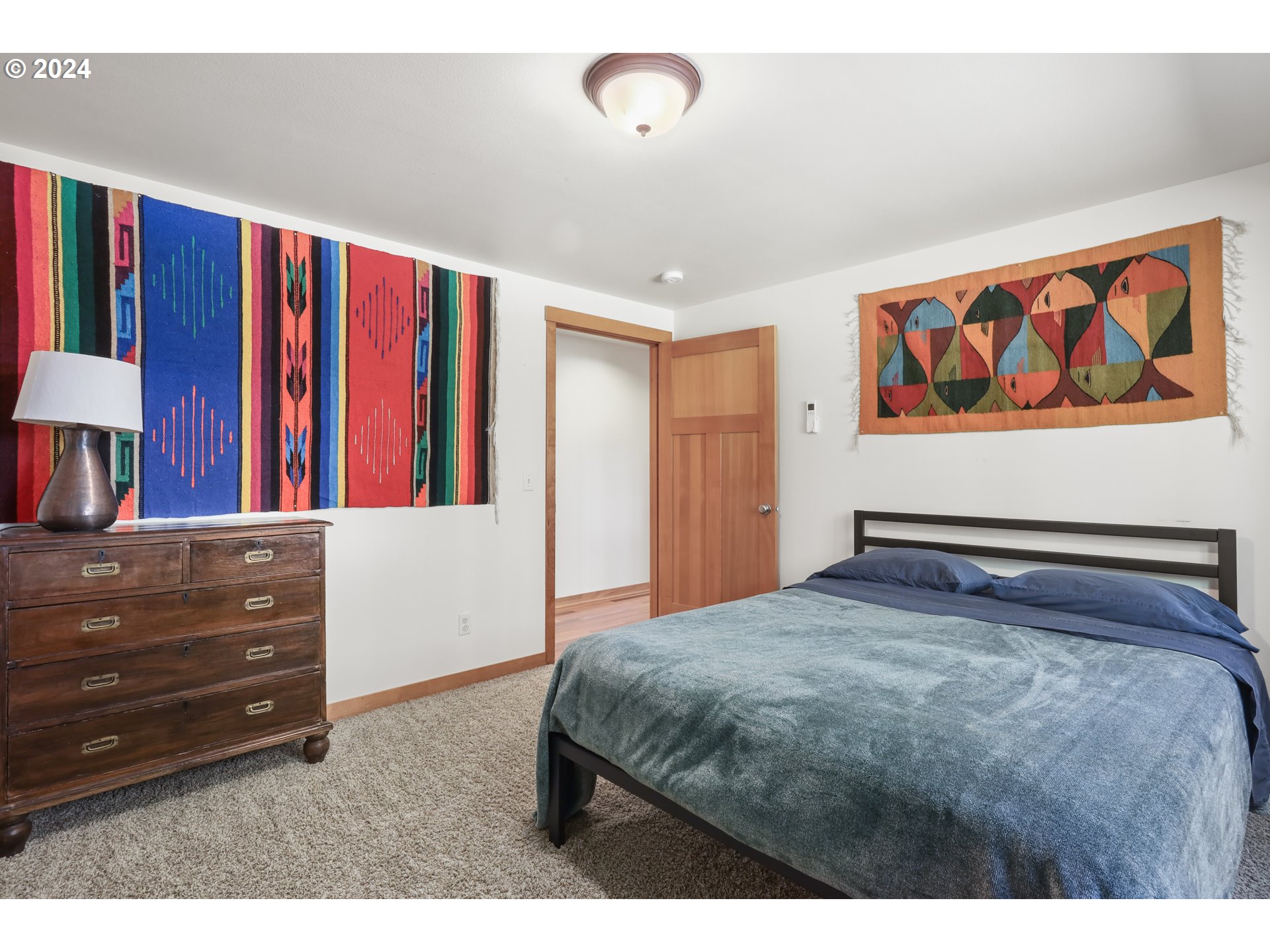 7 Rattlesnake Road White Salmon, WA 98672 - Photo 13 of 41 a bedroom with a bed and a painting on the wall