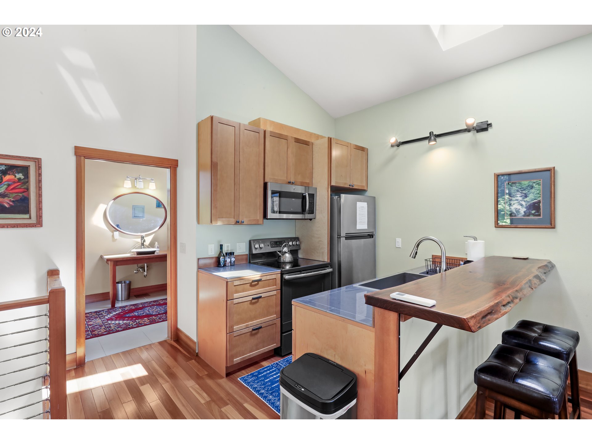 7 Rattlesnake Road White Salmon, WA 98672 - Photo 19 of 41 a kitchen with stainless steel appliances granite countertop a stove refrigerator and a microwave