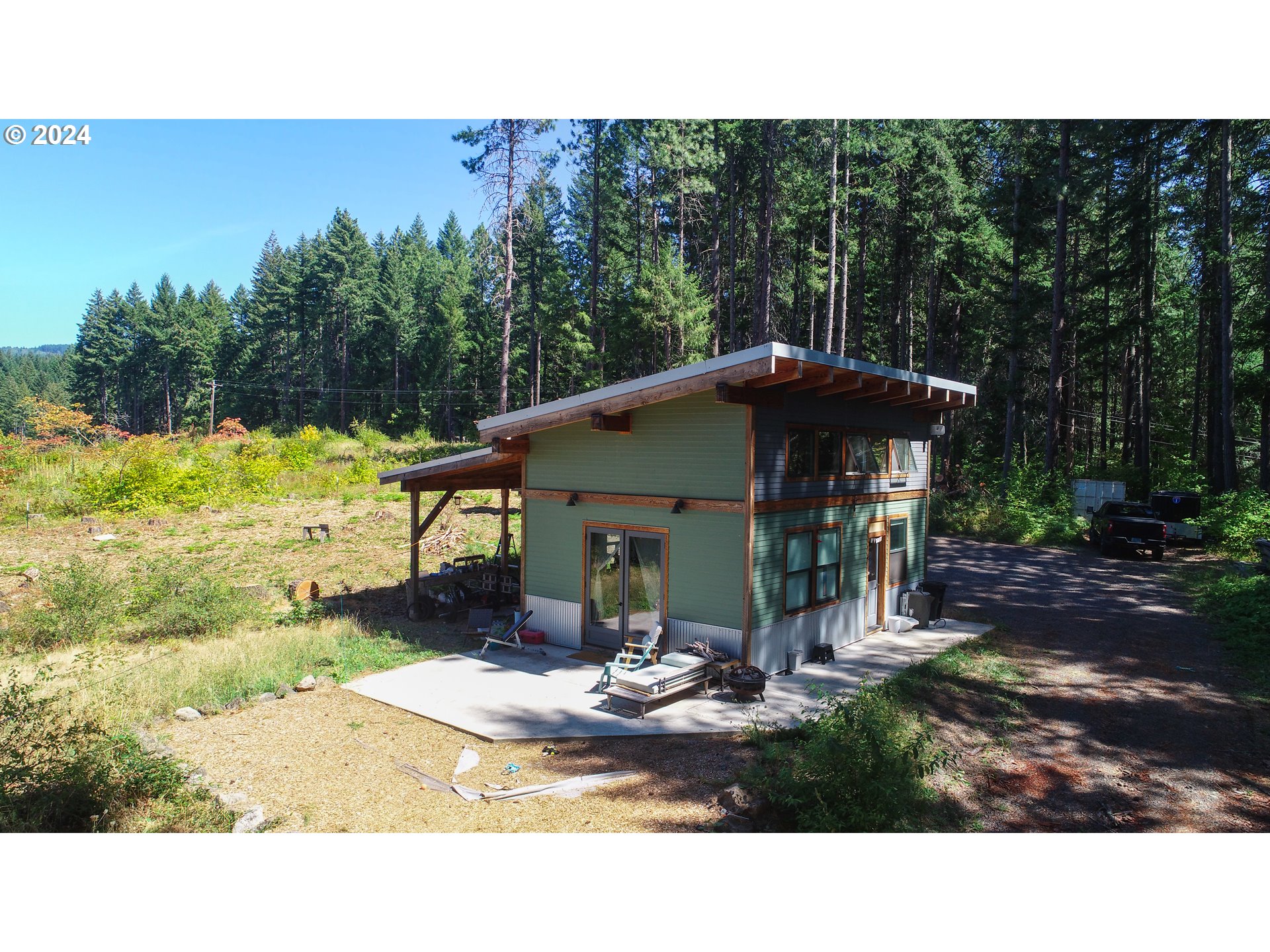 7 Rattlesnake Road White Salmon, WA 98672 - Photo 22 of 41 a view of a house with backyard porch and garden