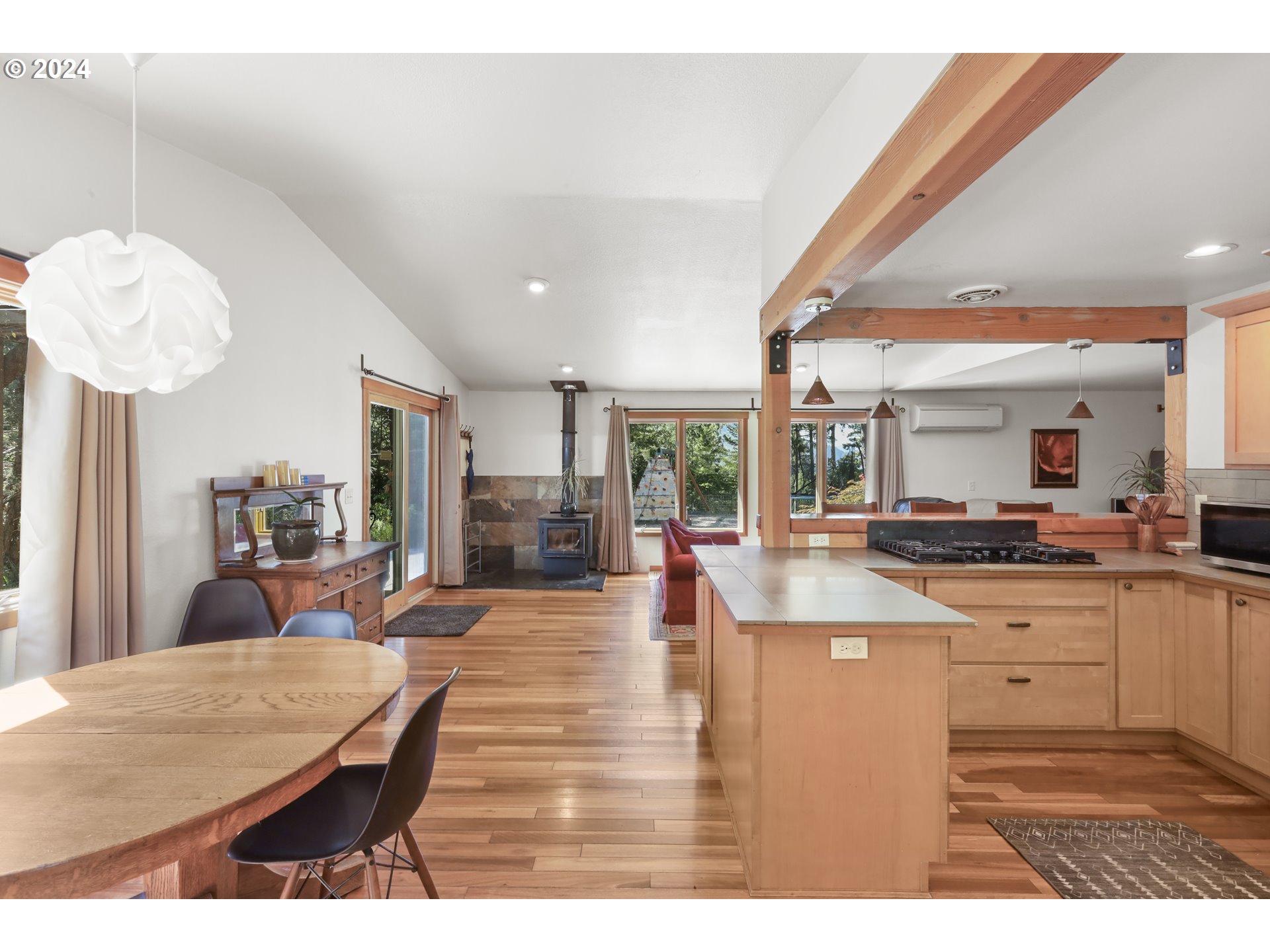 7 Rattlesnake Road White Salmon, WA 98672 - Photo 6 of 41 a living room with stainless steel appliances kitchen island granite countertop furniture and a large window