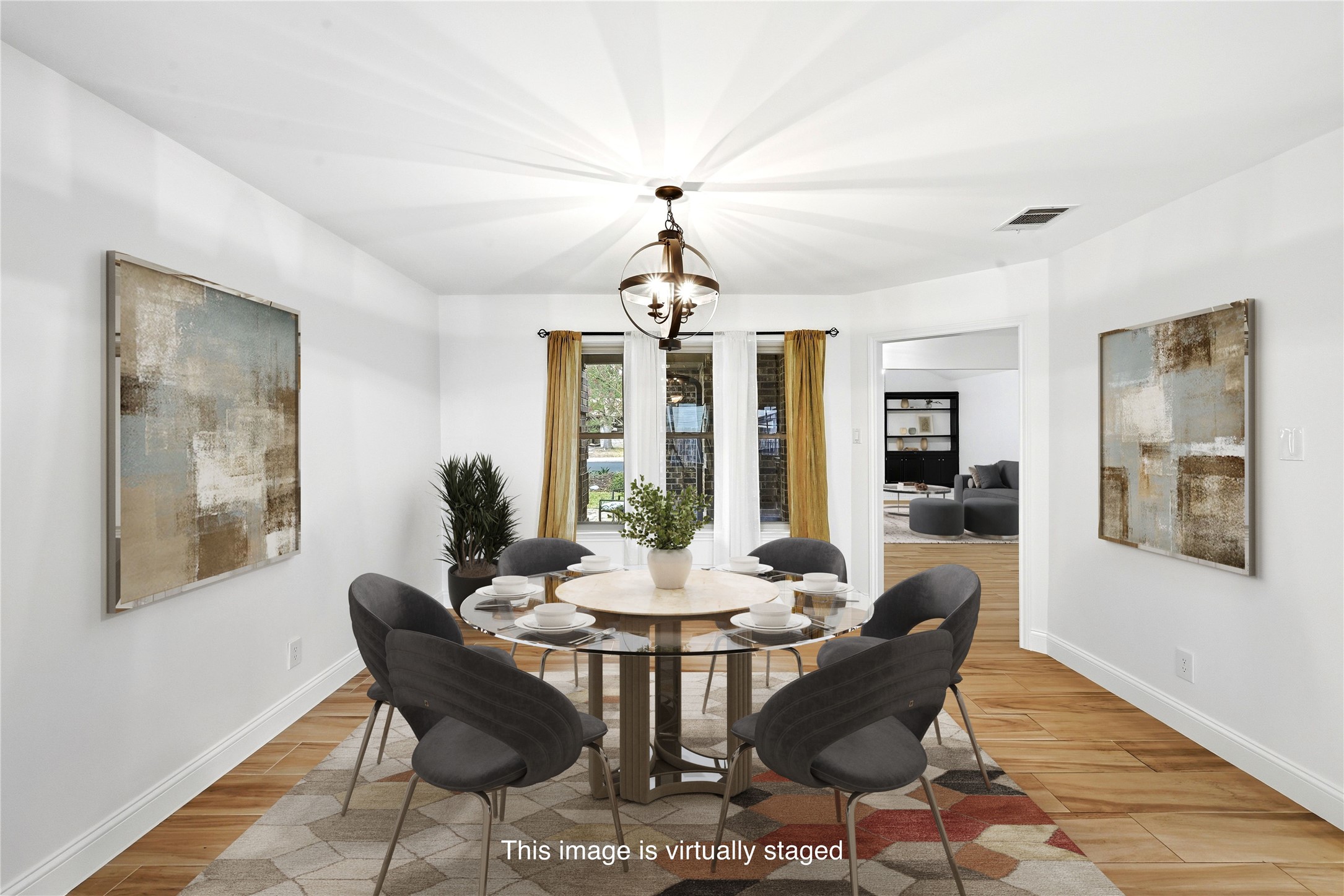 11218 Stormy Ridge Road Austin, TX 78739 - Photo 10 of 38 Gleaming tile floors and a central light fixture define this inviting dining room space.