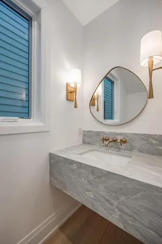 a bathroom with a sink and a mirror