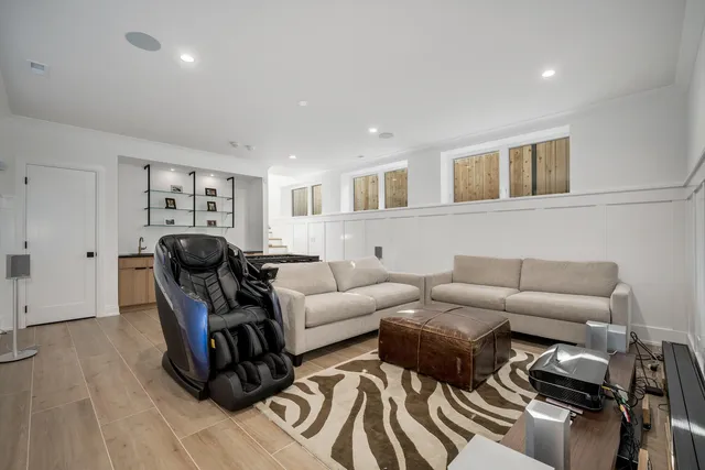 a living room with furniture a couch and wooden floor
