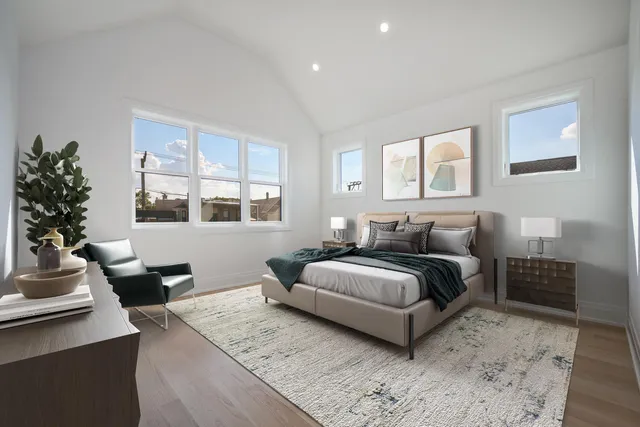 a spacious bedroom with a bed and window