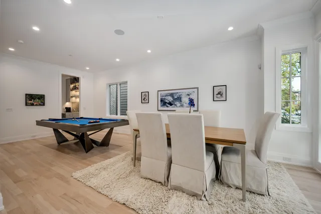 a living room with furniture a rug and a table
