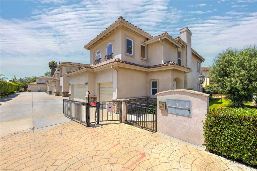 11552 Lower Azusa Road El Monte, CA 91732 - Photo 1 of 41 a view of a white house with a large outdoor space