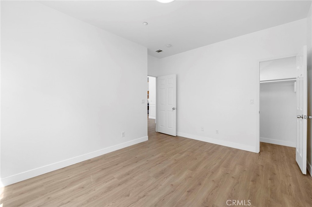 11552 Lower Azusa Road El Monte, CA 91732 - Photo 12 of 41 a view of an empty room with wooden floor