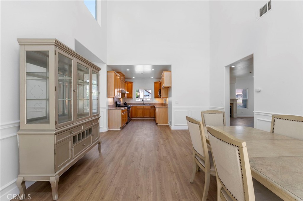 11552 Lower Azusa Road El Monte, CA 91732 - Photo 14 of 41 a kitchen with stainless steel appliances granite countertop a refrigerator a stove and a wooden floors