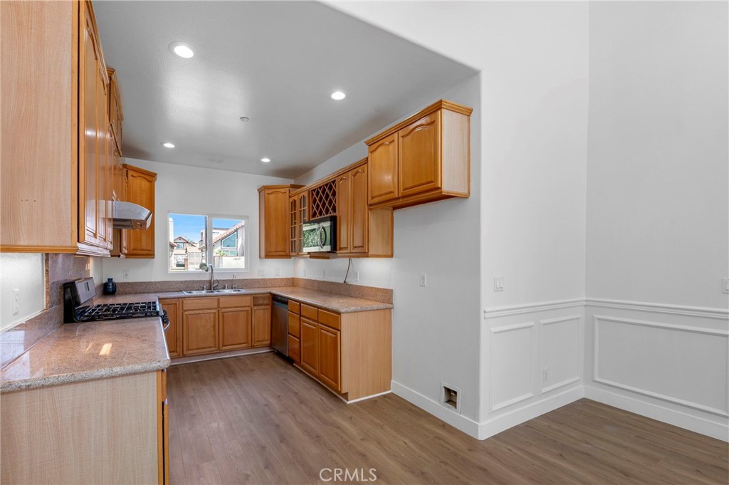 11552 Lower Azusa Road El Monte, CA 91732 - Photo 16 of 41 a kitchen with stainless steel appliances granite countertop a sink and cabinets
