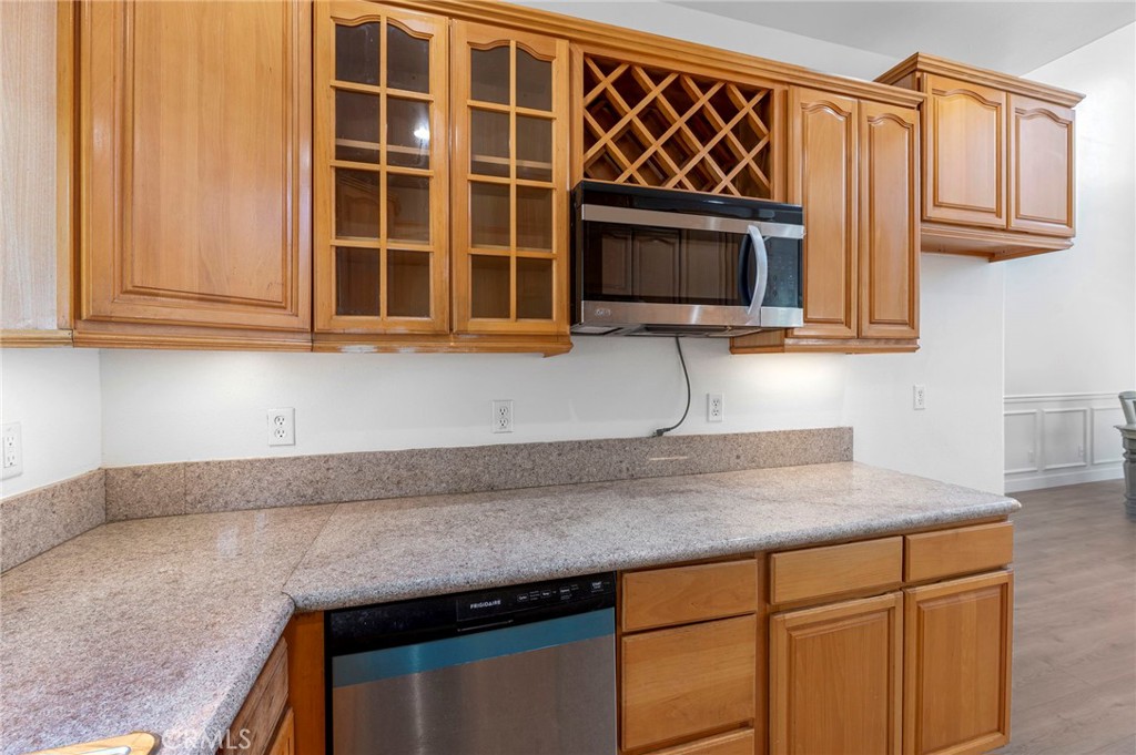 11552 Lower Azusa Road El Monte, CA 91732 - Photo 18 of 41 a kitchen with stainless steel appliances granite countertop a sink and a microwave