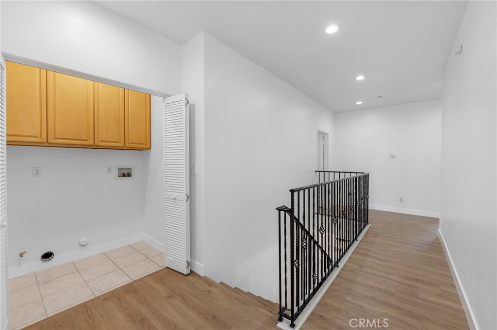 11552 Lower Azusa Road El Monte, CA 91732 - Photo 20 of 41 a view of a hallway with wooden floor and entryway