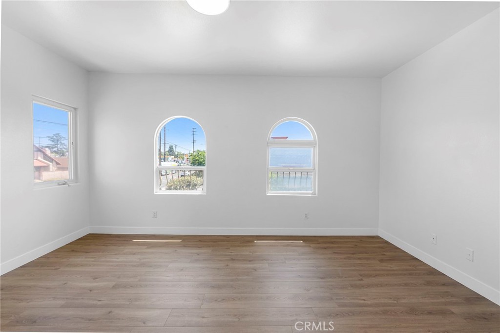 11552 Lower Azusa Road El Monte, CA 91732 - Photo 21 of 41 an empty room with wooden floor and window