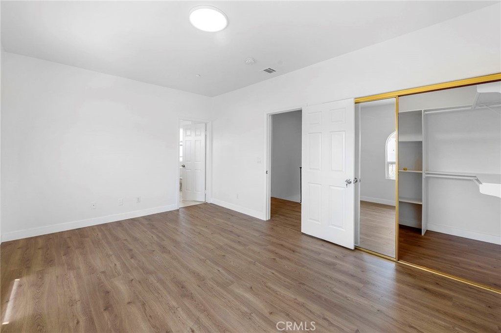 11552 Lower Azusa Road El Monte, CA 91732 - Photo 22 of 41 a view of empty room with wooden floor and window