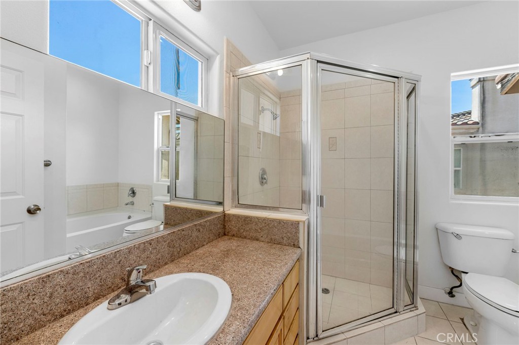11552 Lower Azusa Road El Monte, CA 91732 - Photo 23 of 41 a bathroom with a granite countertop sink toilet and shower