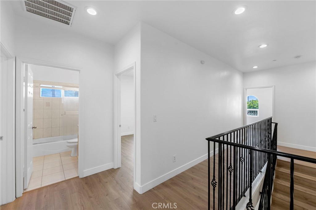 11552 Lower Azusa Road El Monte, CA 91732 - Photo 25 of 41 a view of a hallway with wooden floor and stairs