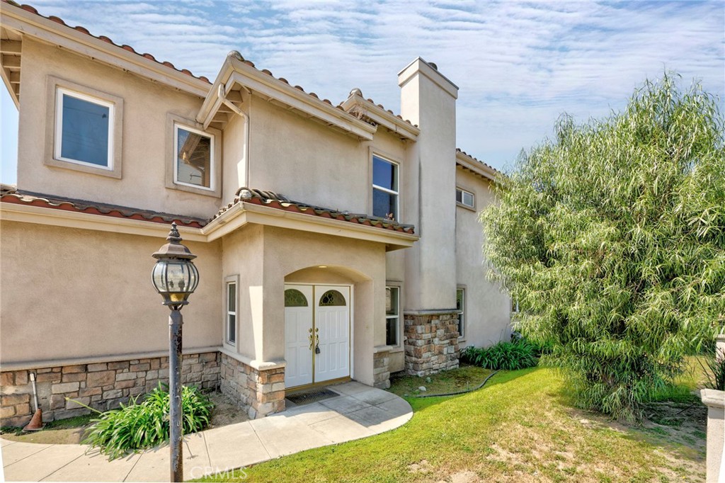11552 Lower Azusa Road El Monte, CA 91732 - Photo 3 of 41 a front view of a house with garden