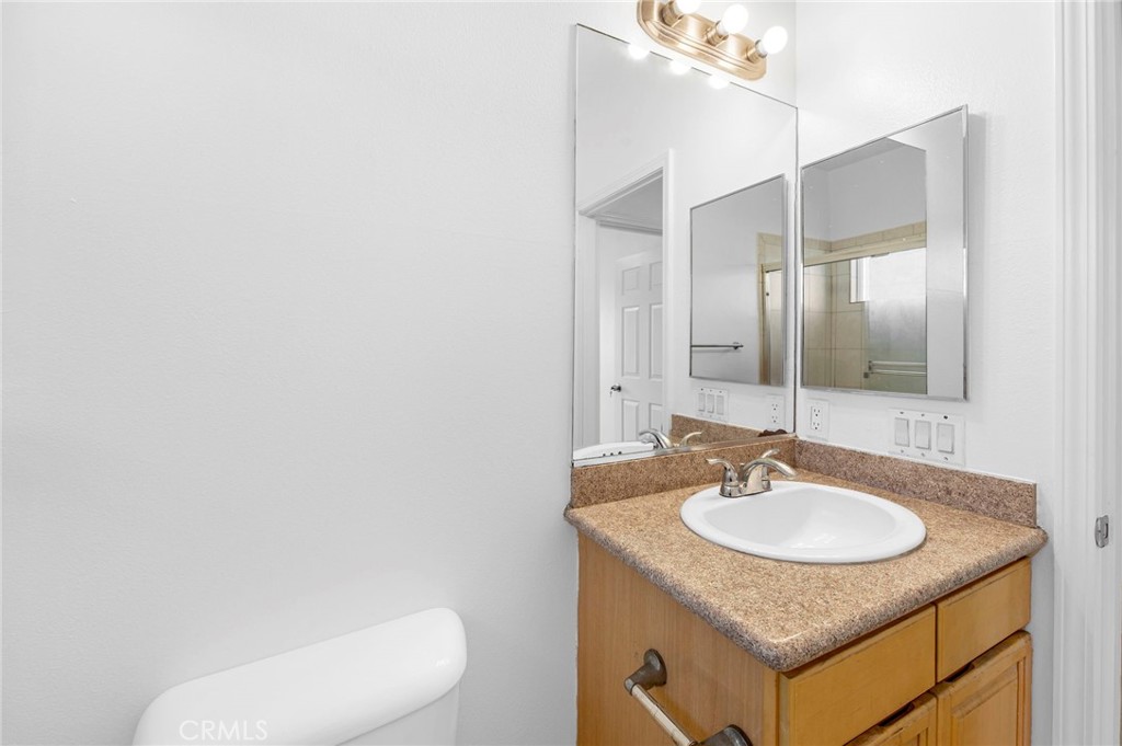 11552 Lower Azusa Road El Monte, CA 91732 - Photo 34 of 41 a bathroom with a granite countertop sink and a mirror