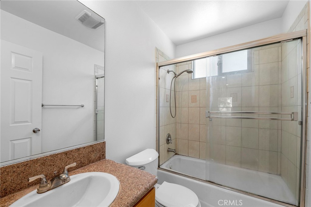 11552 Lower Azusa Road El Monte, CA 91732 - Photo 9 of 41 a bathroom with a granite countertop sink toilet and shower