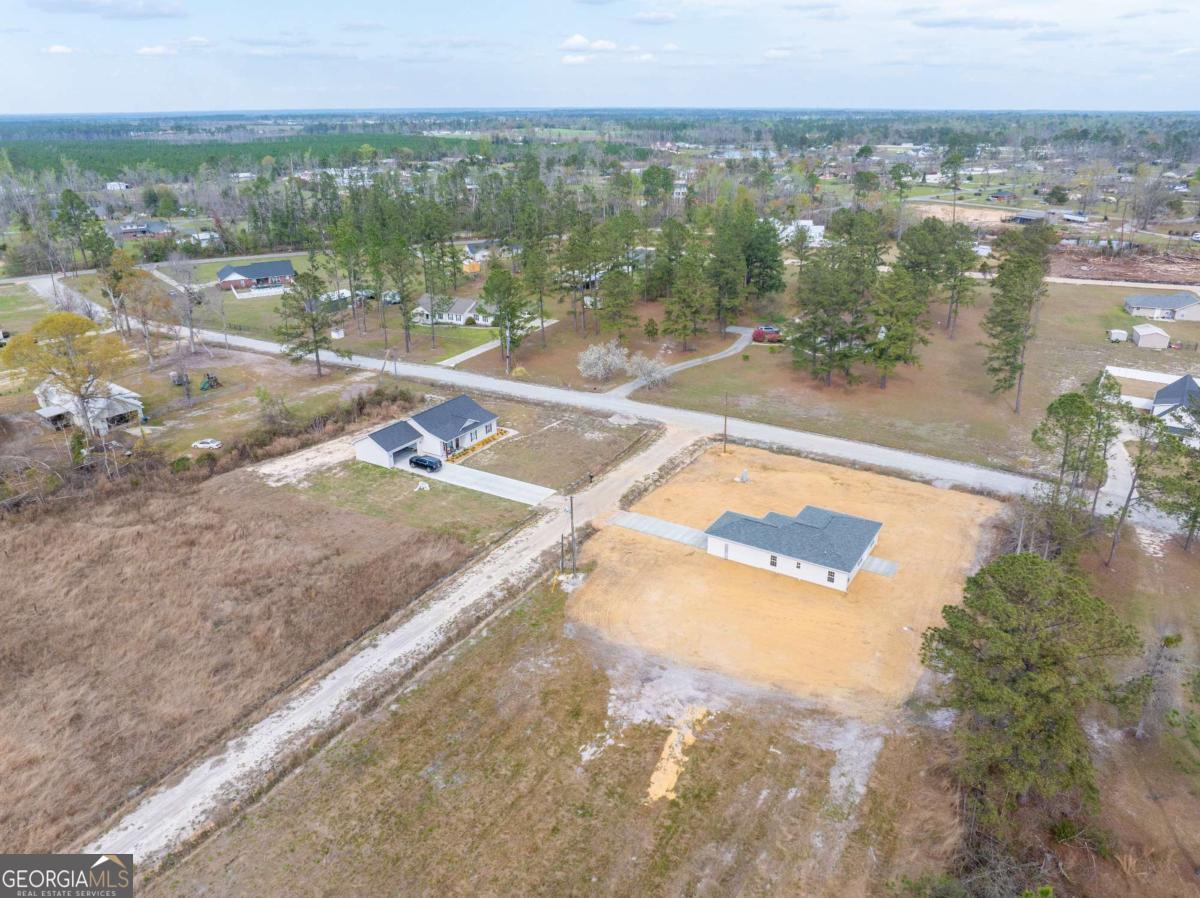 96 Beech Road Hazlehurst, GA 31539 - Photo 12 of 32 a view of a lake with a city