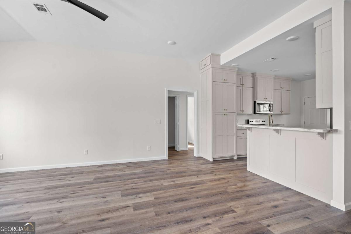 96 Beech Road Hazlehurst, GA 31539 - Photo 18 of 32 a view of kitchen with wooden floor