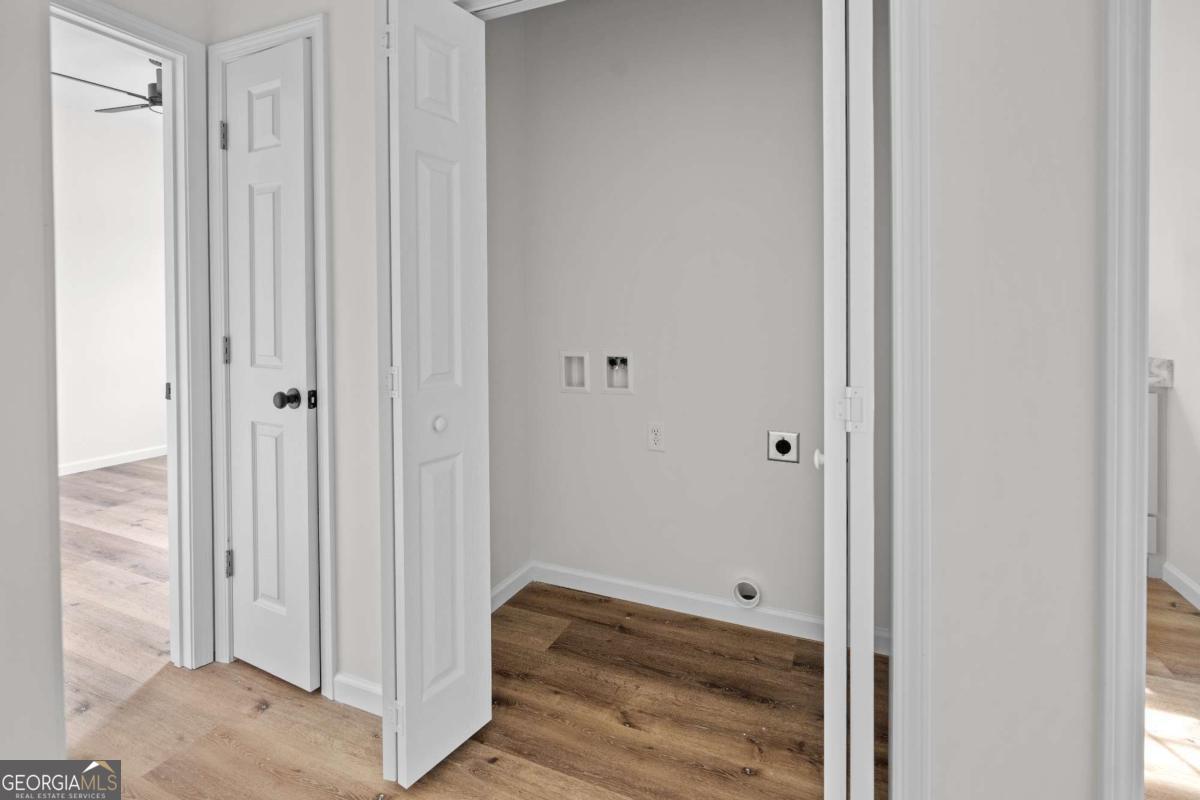 96 Beech Road Hazlehurst, GA 31539 - Photo 30 of 32 a view of a hallway with wooden floor