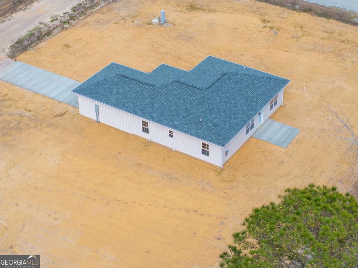 96 Beech Road Hazlehurst, GA 31539 - Photo 8 of 32 a view of a large house with a yard