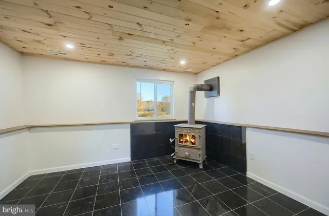 a bathroom with a sink mirror and shower
