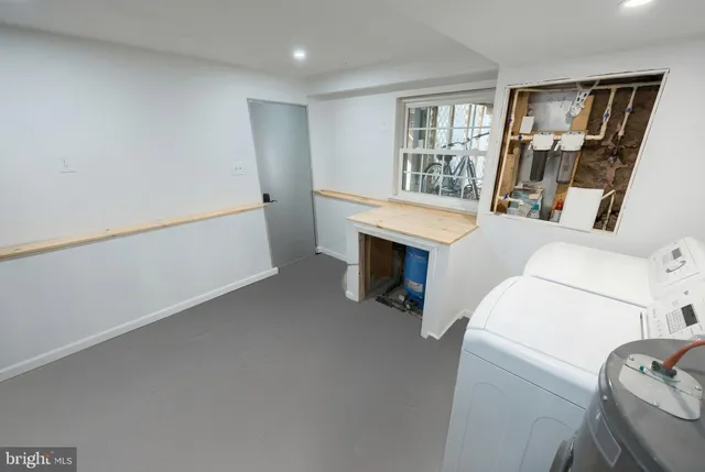 a view of storage and utility room with washer and dryer